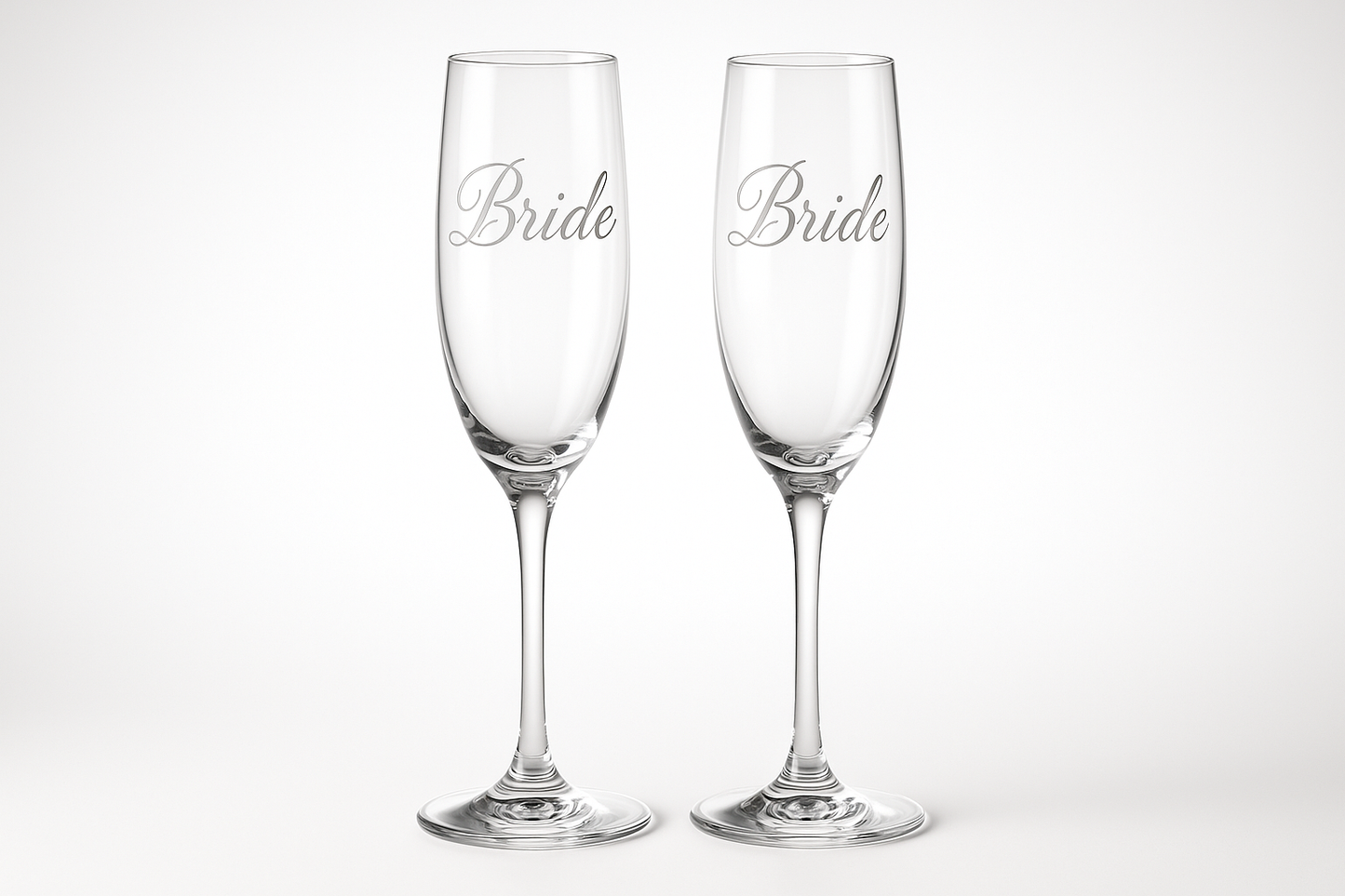 Elegant champagne flutes with "Bride" etched in beautiful script font